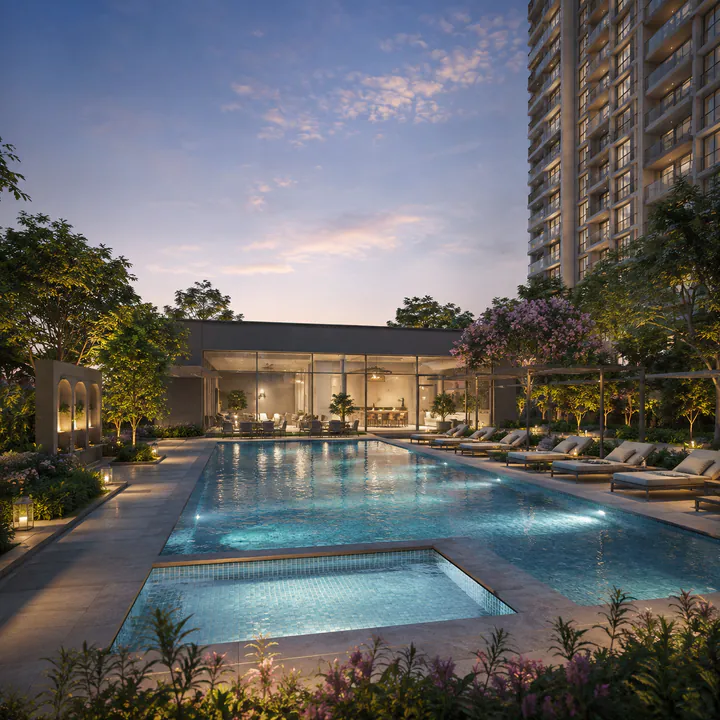 Adarsh Bellahalli swimming pool and deck with the clubhouse frontage behind